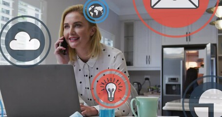 Poster - Animation of digital icons over caucasian blonde woman talking on smartphone using laptop