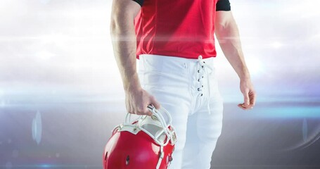 Poster - Animation midsection of male american football player holding helmet at floodlit stadium
