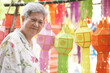 © 88studio - asian old elderly elder woman with hanging festive paper lantern