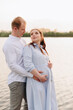 © ShevarevAlex - Young heterosexual pregnant couple in an outdoor park