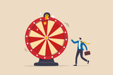 Fototapeta  - Life depend on luck, fortune wheel randomness, chance and opportunity to get new job, investment winning or gambling concept, excite businessman looking at spinning fortune wheel waiting for luck.