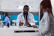 © DC Studio - African american doctor and patient with pregnancy talking about healthcare and support. Specialist giving medical advice to young woman expecting child, preparing to give birth.