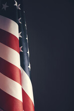 Standing Flag United States Of America On Dark Gray Background.Banner Of America In Retro Style.