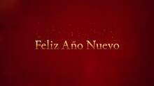 "Happy New Year" In Spanish Gold Text On Red Background.