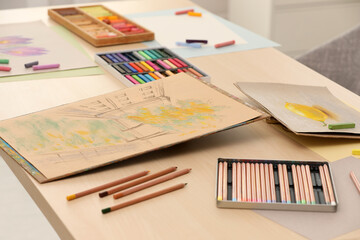 Canvas Print - Artist's workplace with drawings, soft pastels and color pencils on table