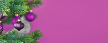 Purple Christmas Banner With Tree Bauble On Decorated Tree With Copy Space