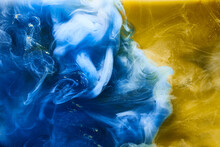 Blue Yellow Smoke On White Ink Background, Colorful Fog, Abstract Swirling Ocean Sea, Acrylic Paint Pigment Underwater