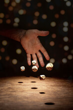 The Dice Thrown By The Hand Are Scattered