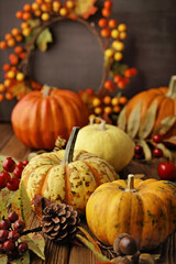  autumn background with pumpkins and colorful leaves on wooden background. Halloween or Thanksgiving Day design