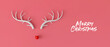Abstract minimal Christmas reindeer face made with antlers and a bauble decoration nose. 3D Rendering