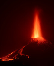 Bright Orange Lava Emitting Out Of Volcano At Night