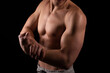 © Alex - Man Showing Biceps Hands Up. Sportsman Showing Muscles. ABS, Biceps Muscles. Black Background. Topless Man Hand Close Up