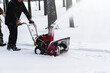 © Alrandir - Men remove snow in the park with a snow blower
