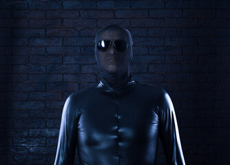 Wall Mural - unknown man in a black mask on a black background