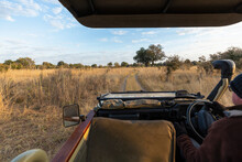 Early Morning, Sunrise On A Wildlife Reserve Landscape, A Safari Jeep Driving.