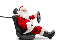 Santa Claus In A Car Seat Holding A Steering Wheel And Showing Thumbs Up