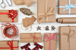 Christmas Flat Lay - Plain brown kraft paper wrapped presents with accessories filling the entire frame.