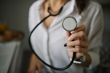 Close-up Of A Woman Holding A Stethoscope.