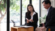 © wichayada - Middle aged businessman having an informal meeting with his financial manager. asian businesspeople concept.
