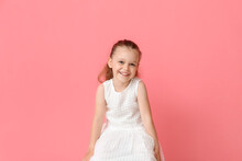 Portrait Of Pretty Little Girl On Color Background