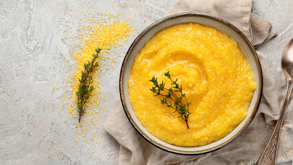 Wall Mural - Corn polenta on gray background.