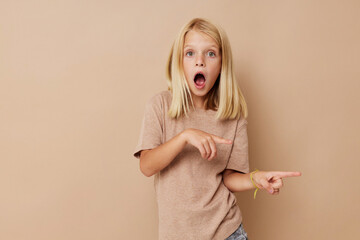 Wall Mural - Beautiful little girl with blond hair isolated background