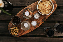 High Angle View Of Snacks On Wooden Board