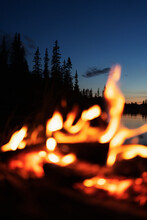 Bonfire At Lakeside At Dusk