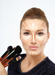 Wall Mural - Contouring.Make up woman face. Contour and highlight makeup.