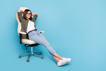 Wall Mural - full body photo of positive lady sit chair hands head relaxing weekend wear khaki outfit isolated ov