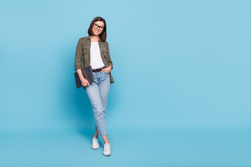 Wall Mural - Full body photo of positive intelligent lady hold netbook stand empty space isolated over sky light color background