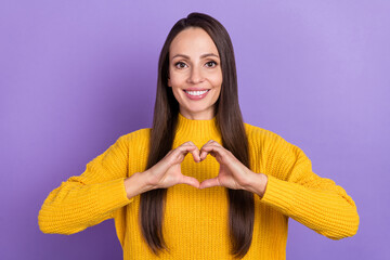 Sticker - Photo of flirty brunette young lady show heart wear yellow sweater isolated on violet color background