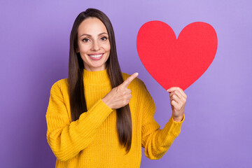 Poster - Photo of cute brunette young lady index heart wear yellow pullover isolated on violet color background