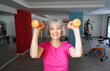 © luengo_ua - Healthy lifestyle and sport. Pretty senior woman exercising in gym.