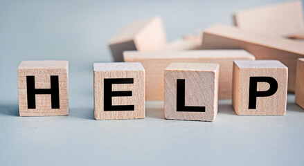 Wall Mural - HELP - the inscription on wooden cubes on a white background