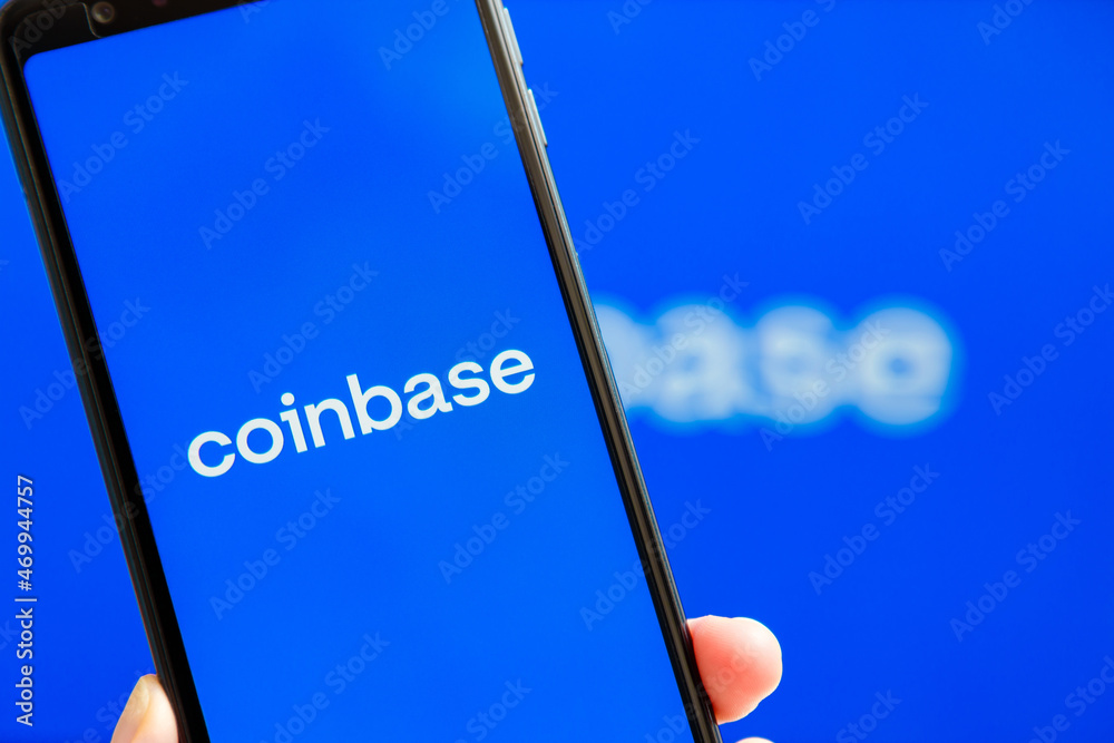Ukraine, Odessa - October, 9 2021: Coinbase mobile app running at smartphone screen with Coinbase logo at background. Coinbase - American cryptocurrency exchange and trading platform.