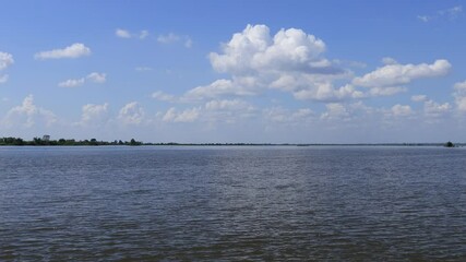 Wall Mural - Blue sky and white clouds. The fluffy cloud moves in the blue sky