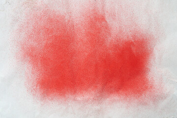 Sticker - red spray paint on a white colored paper background