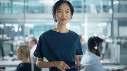 Canvas Print - Successful Businesswoman in Stylish Dress Using Tablet Computer, Standing in Modern Diverse Office Working on Financial, Business and Marketing Projects. Portrait of Beautiful Asian Manager.