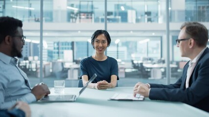 Poster - Modern Office Meeting Room: Beautiful Asian Executive Director Sits in the Head of the Conference Table and Talks to a Group of Businesspeople, Managers and Investors About Company's Financial State.