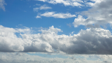 Wall Mural - Cumulus clouds with blue sky on a sunny day of summer. Beautiful cloudscape