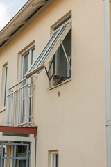 Wall Mural - Furry cat sitting in an open window.