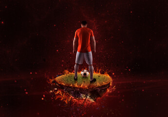 Wall Mural - Football player on a fiery field ready to kick the ball