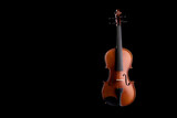 Fototapeta Krajobraz - A wooden violin or viola on a black background