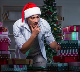 Canvas Print - Man with many christmas gifts in boxes