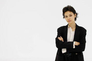 Serious businesswoman in suit on white background