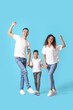 © Pixel-Shot - Happy interracial family on color background
