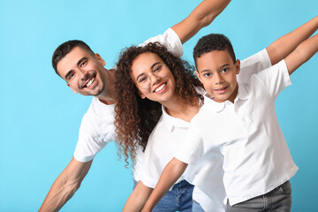 Poster - Happy interracial family on color background