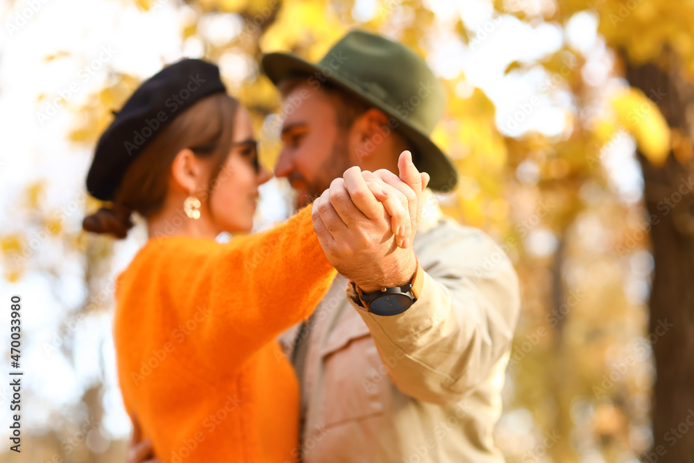 Loving couple dancing in autumn park