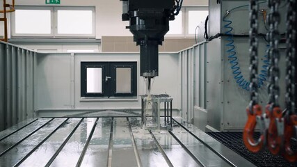 CNC Milling Machine in Operation from a distance in a factory, gimbal
